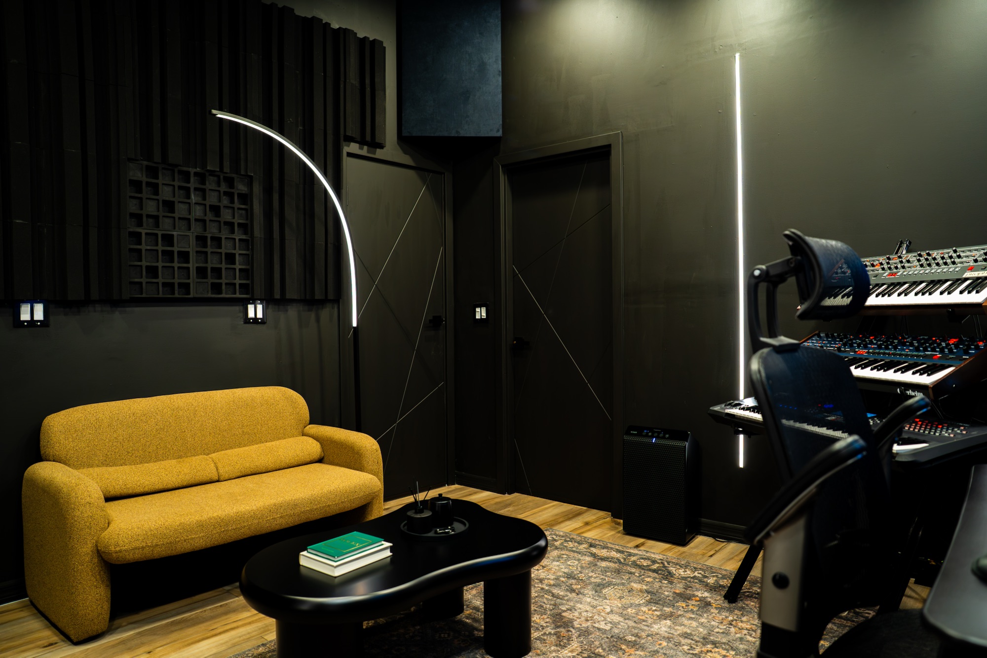 Club Lerna lounge with gold sofa and studio instruments